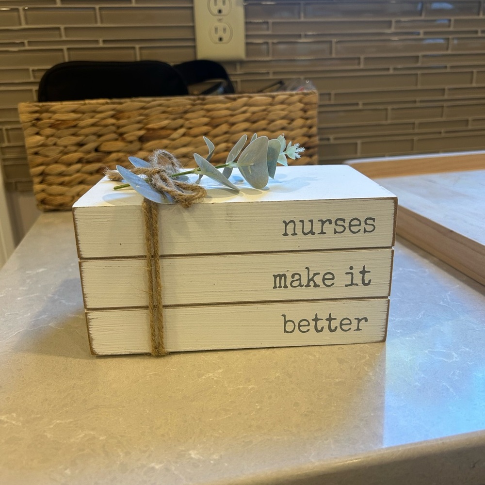 Decorative White Book Stack with Quote